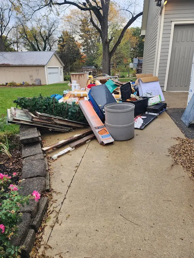 Dumpster being loaded with debris for 12 Yard Dumpster Rental in Phillipsburg